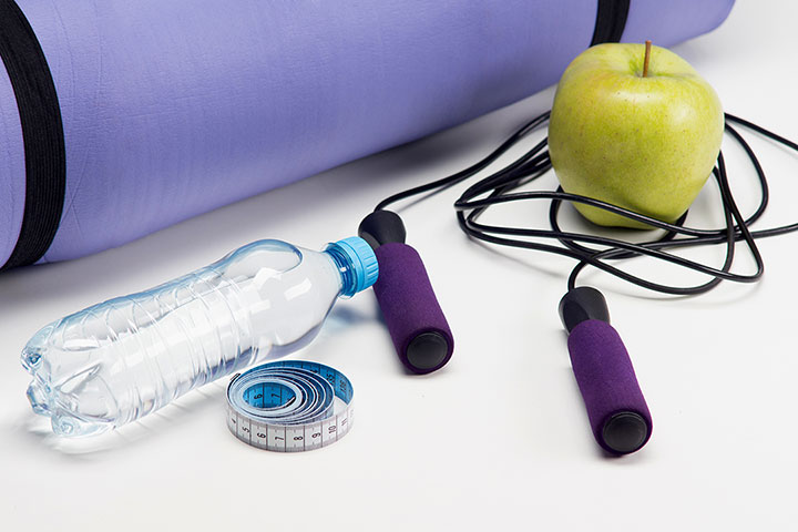 home fitness with jump rope, water bottle, apple